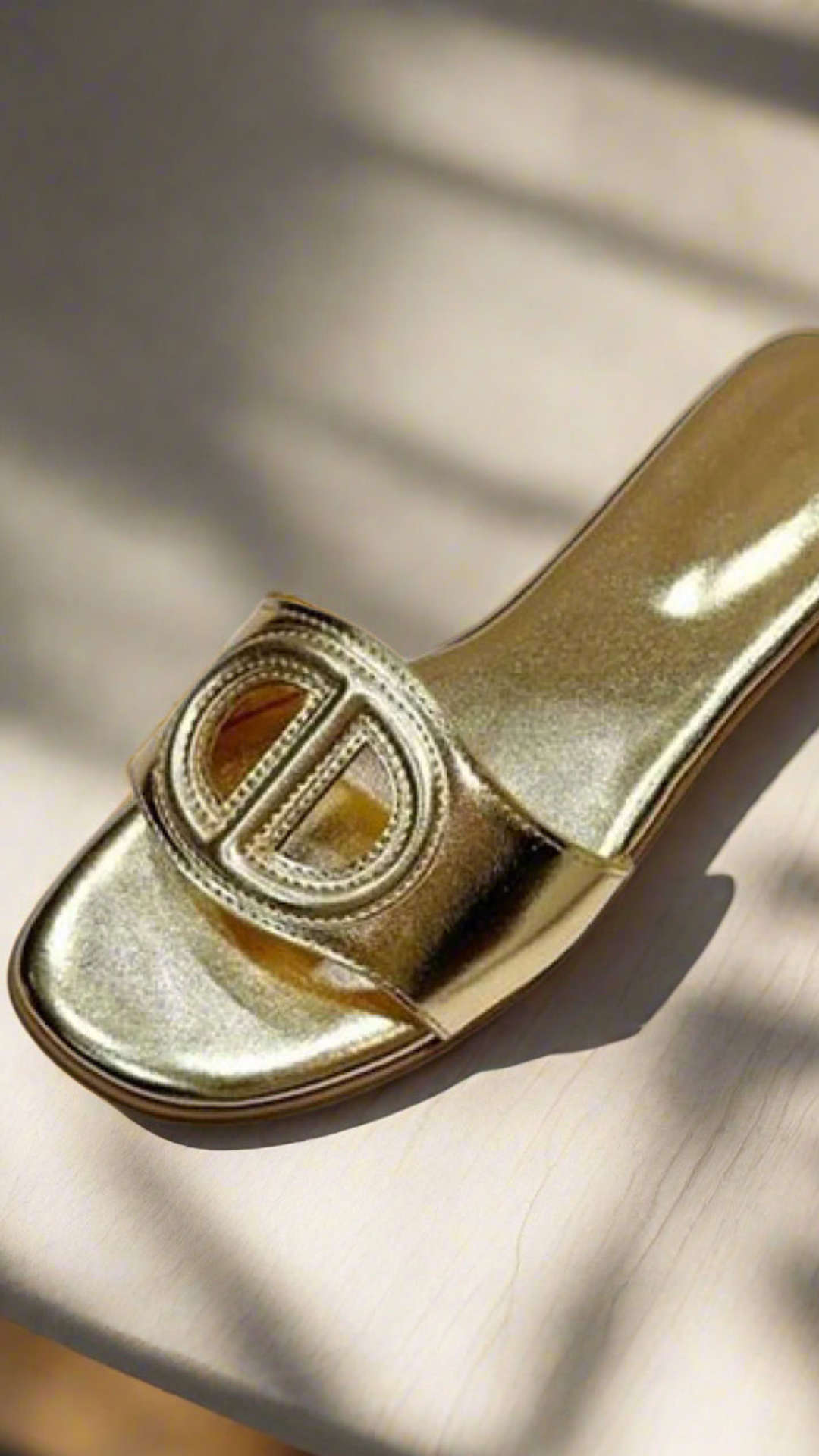 Gold Oval Buckle Cut-Out Slide Sandals.